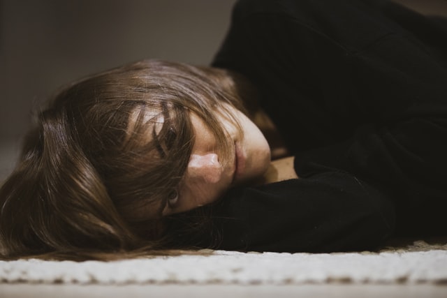 woman face lying down tired